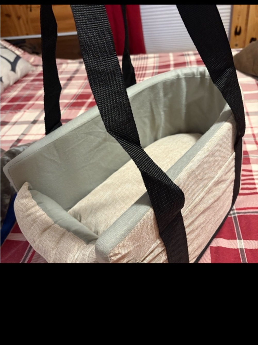 cream colored dog carrier.